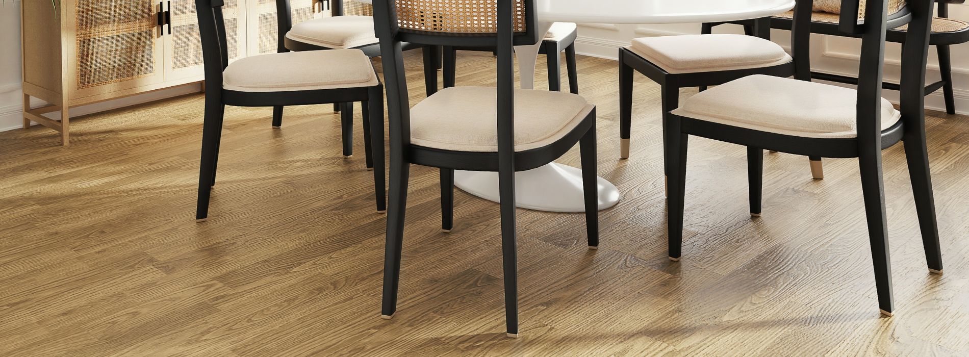Elegant dining area with durable sanded wood flooring, sophisticated black dining chairs, and natural light in Kilburn, NW6.