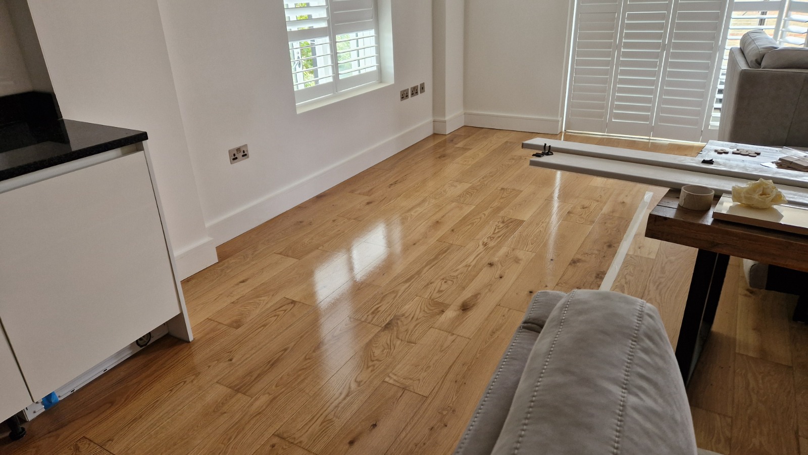 Office Floor Sanding completed on oak engineered plank hardwood floor, freshly sealed with a clear commercial lacquer for a smooth, high-sheen finish.